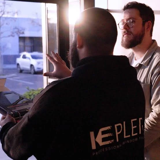 Kepler window-film consultation beside commercial glazing
