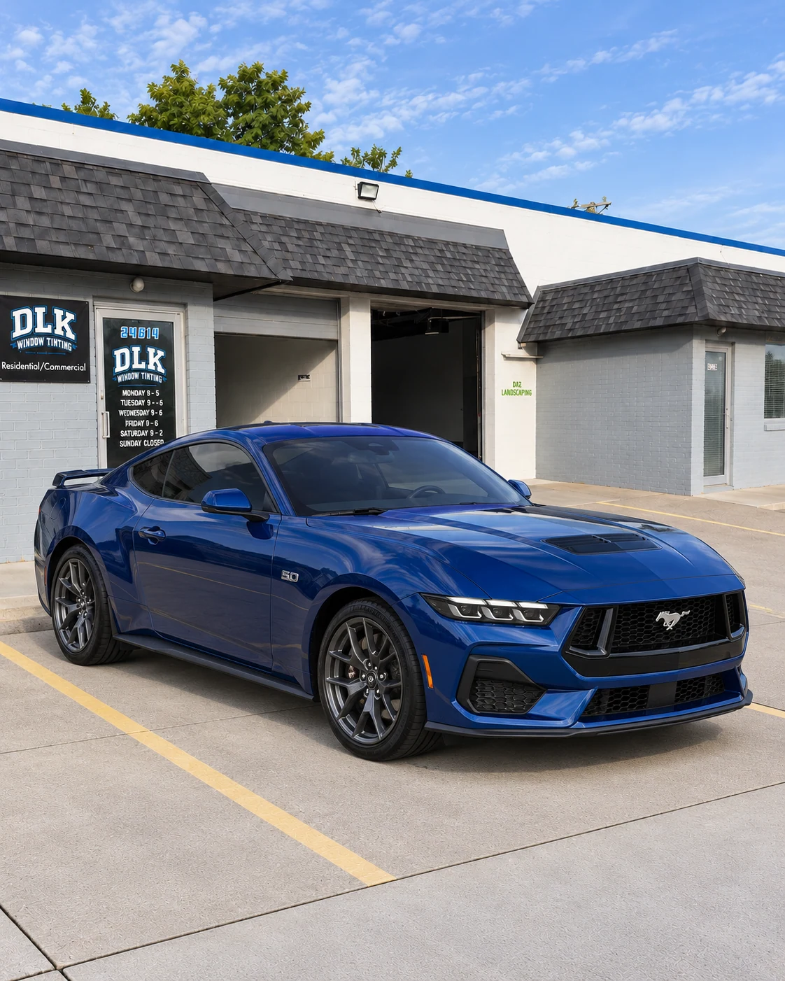 Illustration of a metallic deep blue Ford Mustang GT S650 coupe with tinted windows outside DLK's Mount Clemens shop