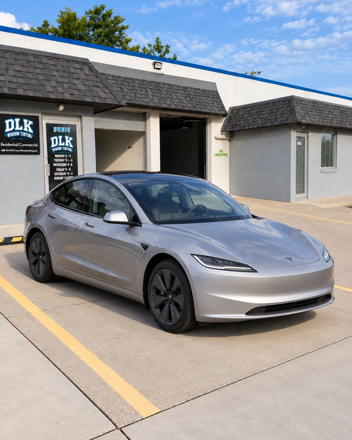 Illustration of a quicksilver light grey Tesla Model 3 Highland with tinted windows outside DLK's Mount Clemens shop
