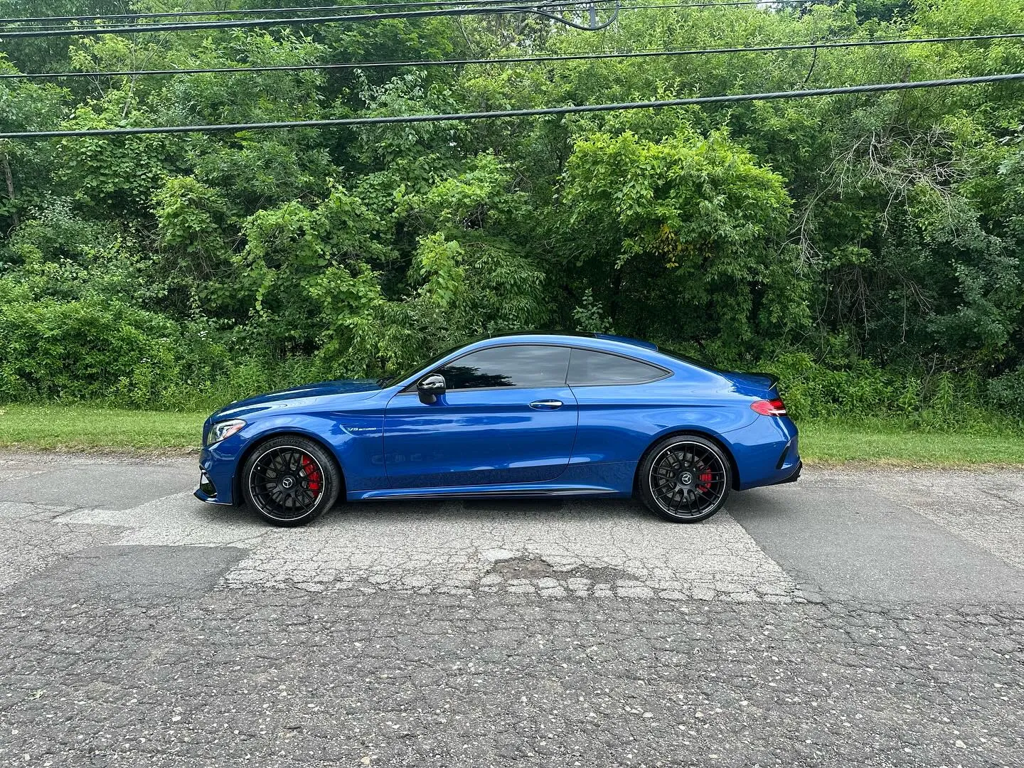 Blue Mercedes-AMG C 63 coupe with tinted windows