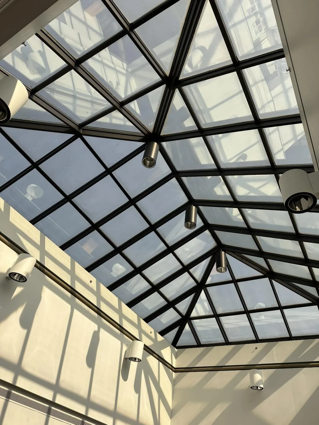 Atrium glass roof fitted with flat-glass window film