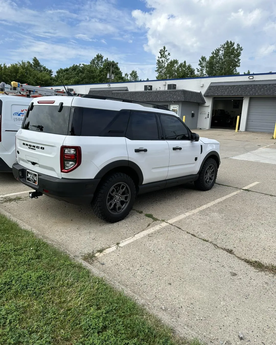 White Ford Bronco Sport with tinted windows at the DLK Window Tinting shop