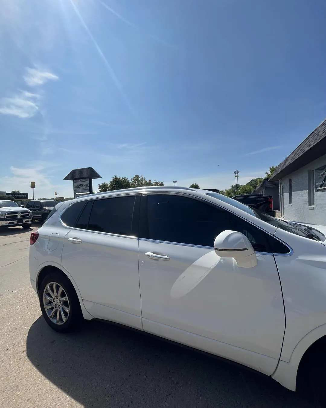 White Buick Envision with tinted windows
