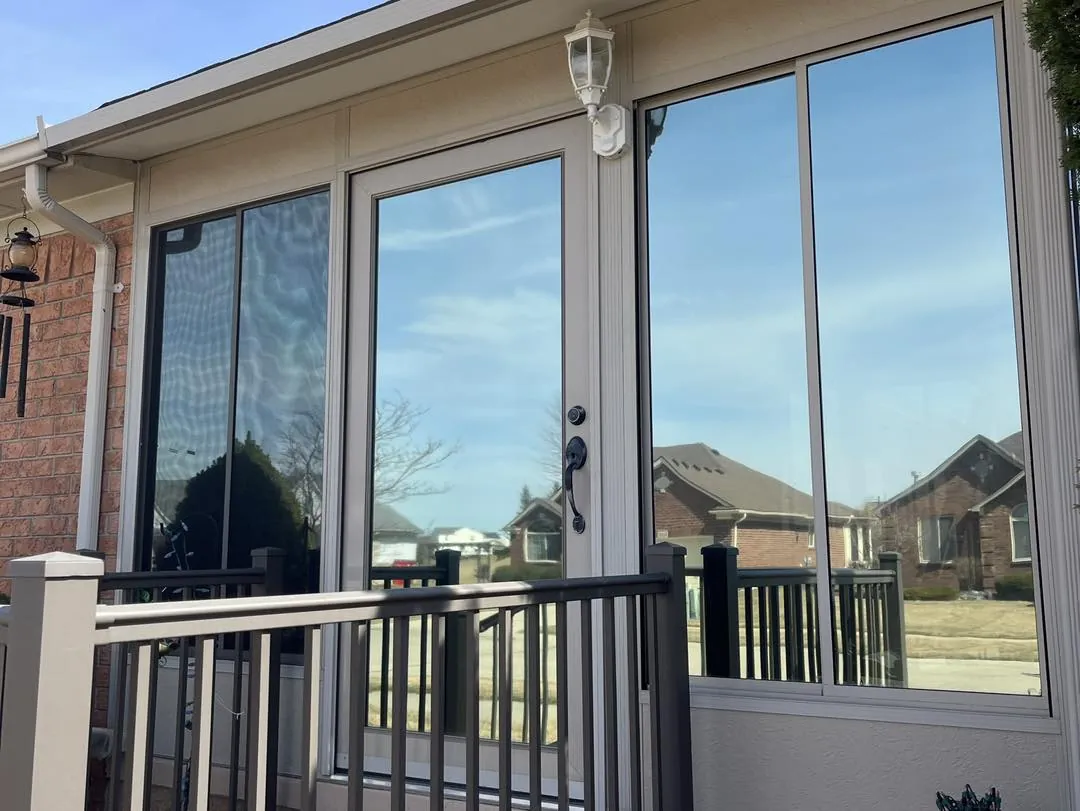 Patio doors onto a deck, fitted with reflective window film