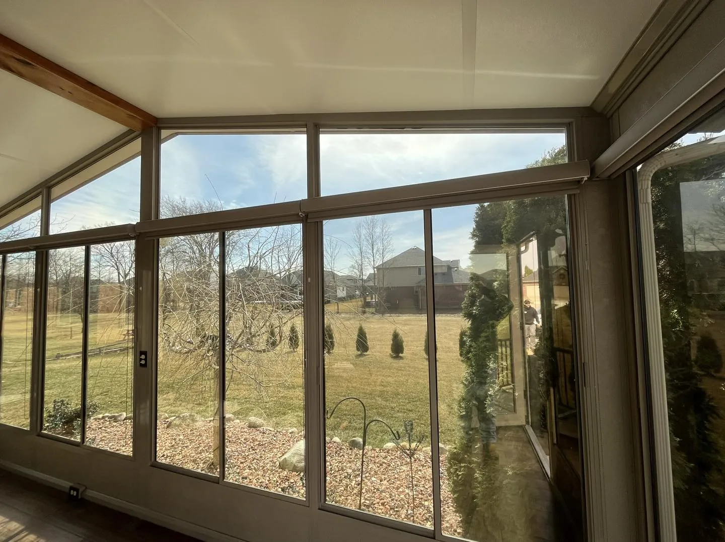 View out of a sunroom through windows fitted with window film