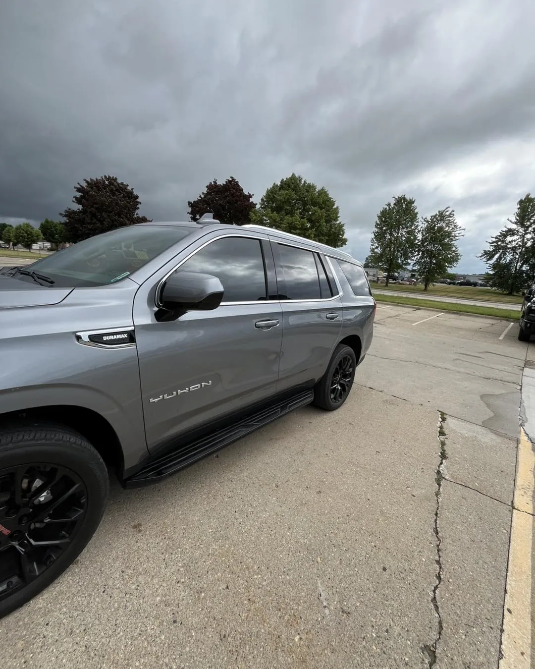 Grey full-size SUV with tinted windows